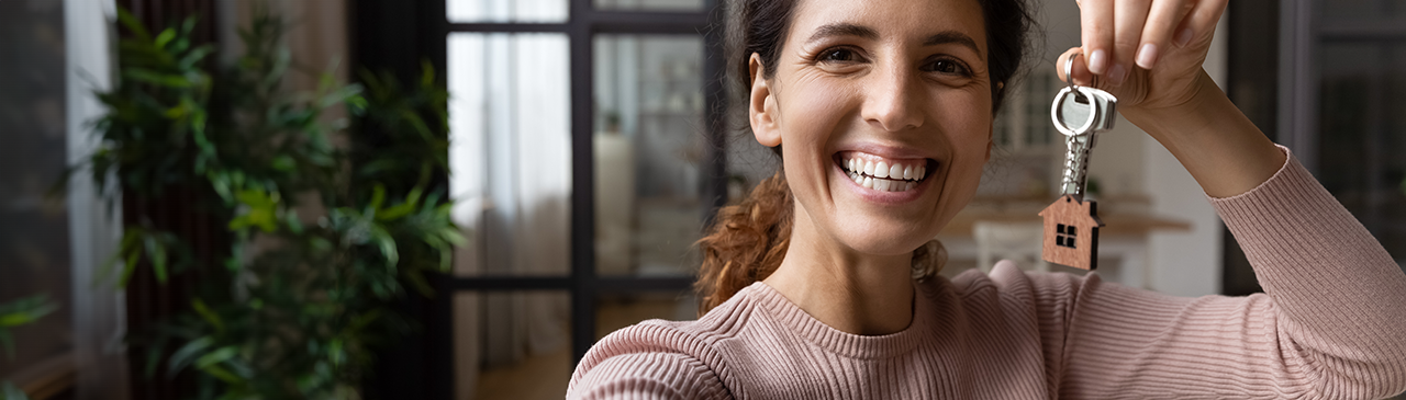 MORTGAGE RATES WOMAN WITH KEY